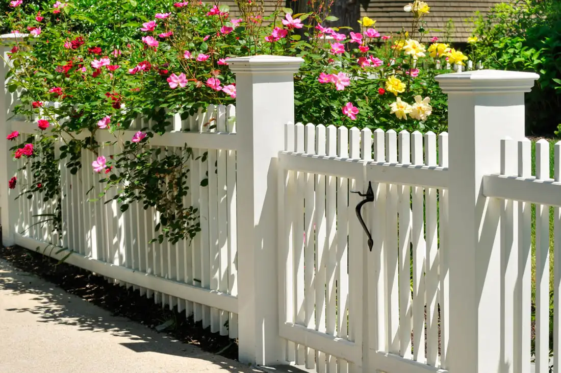 White vinyl picket fence and gate