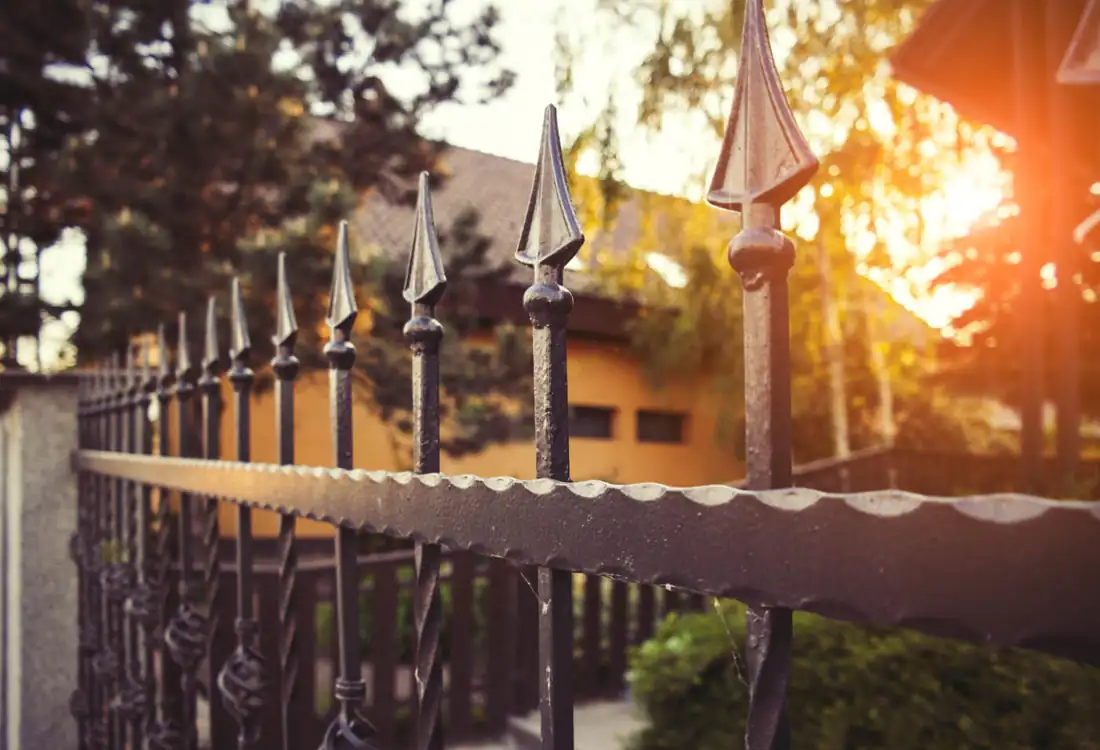 Black ornamental fence with pointed finial tops